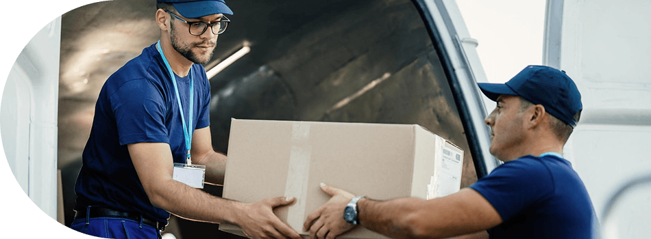 Warehouse workers with safety vests managing inventory